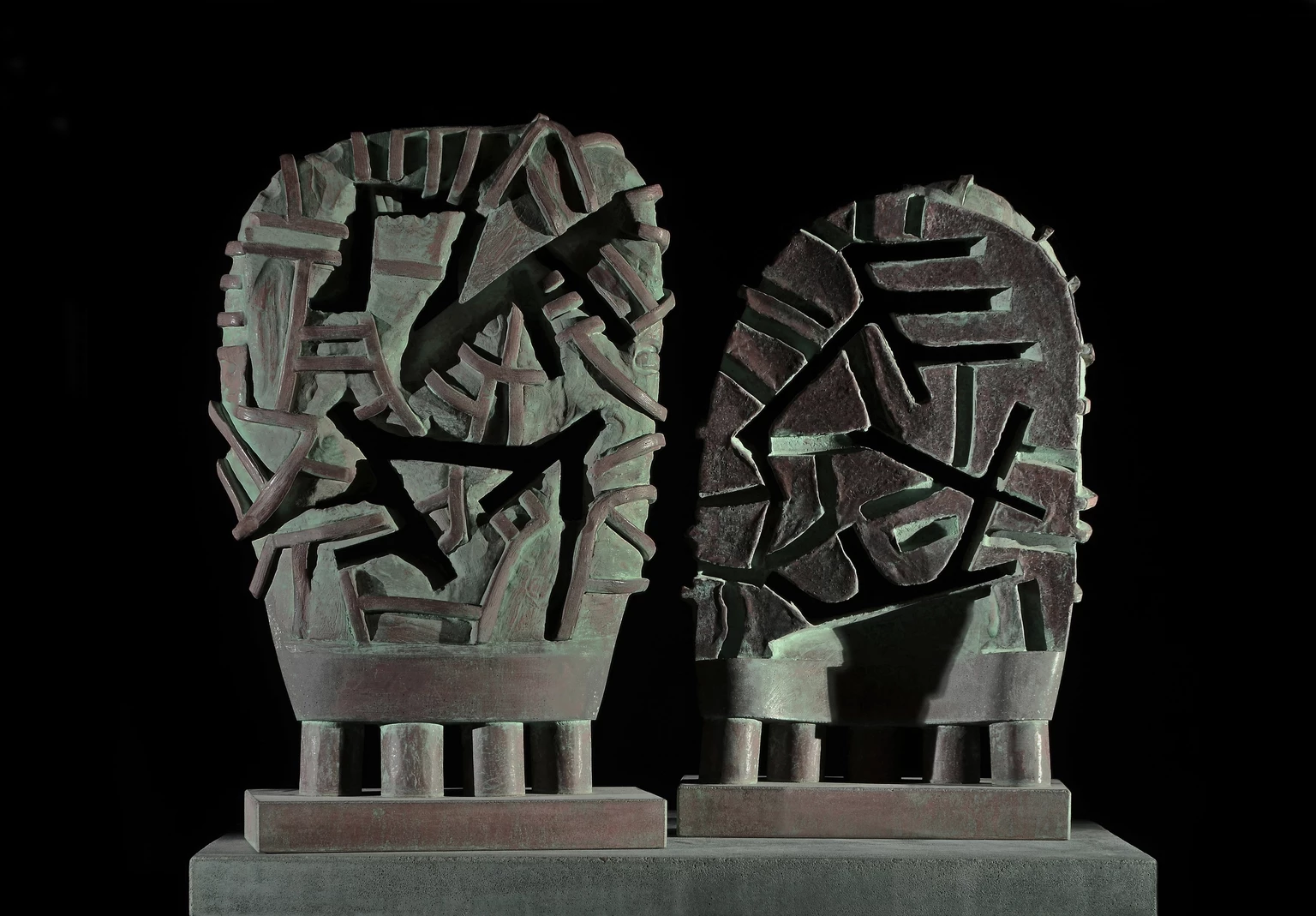 Paired mask, 2001 - colored and painted concrete, 60 x 32.5 x 14 cm, 56 x 32.5 x 14 cm