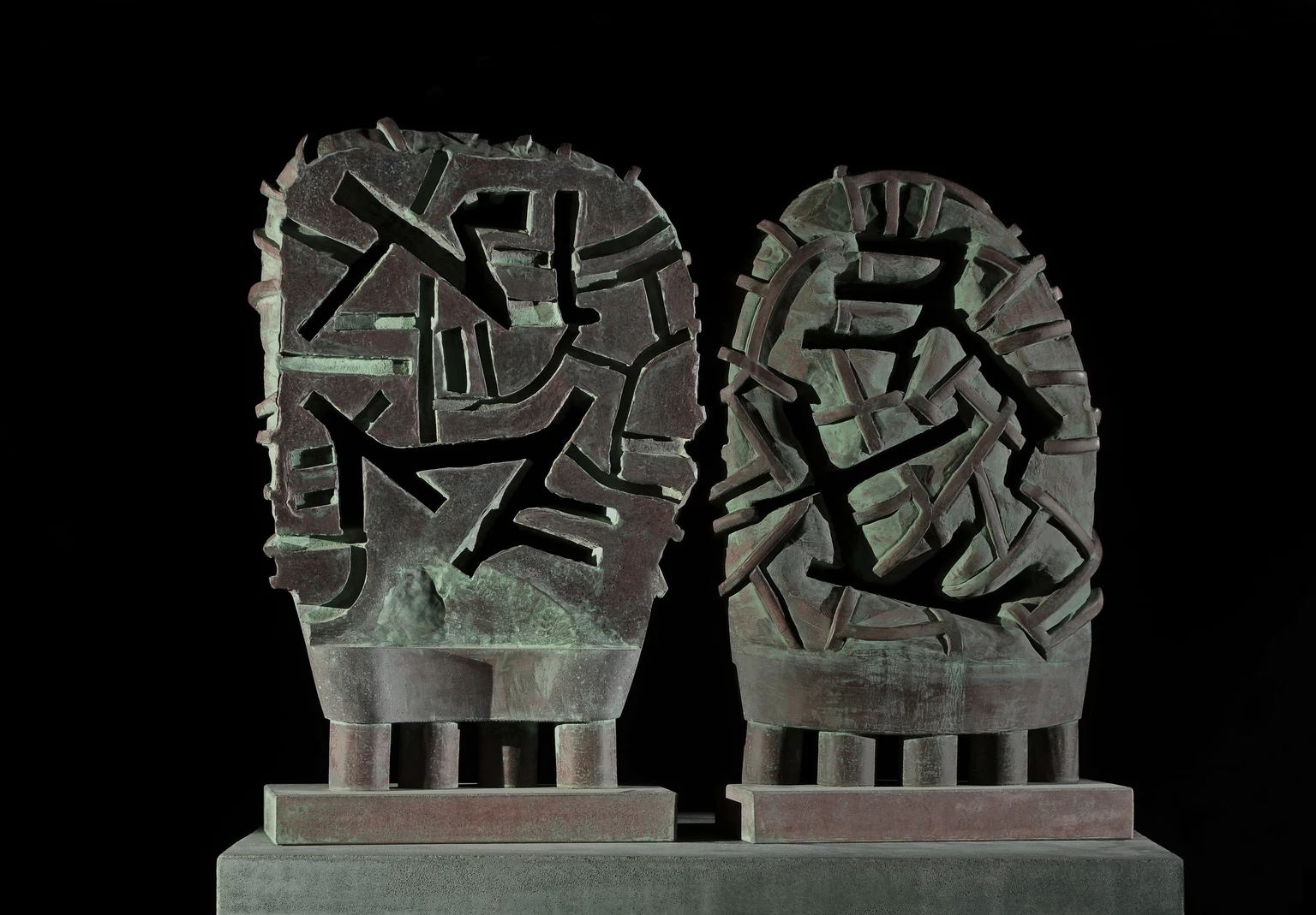 Paired mask, 2001 - colored and painted concrete, 60 x 32.5 x 14 cm, 56 x 32.5 x 14 cm